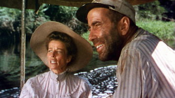 CHARLIE ALLNUT (HUMPHREY BOGART) AND ROSE SAYER (KATHERINE HEPBURN) ABOARD "THE AFRICAN QUEEN" *** Local Caption *** Feature Film